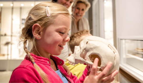 Girl with skeleton in Limburgs Museum in Venlo